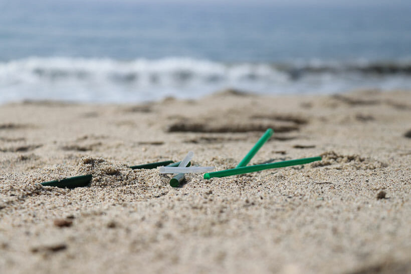 plastic straws on the beach