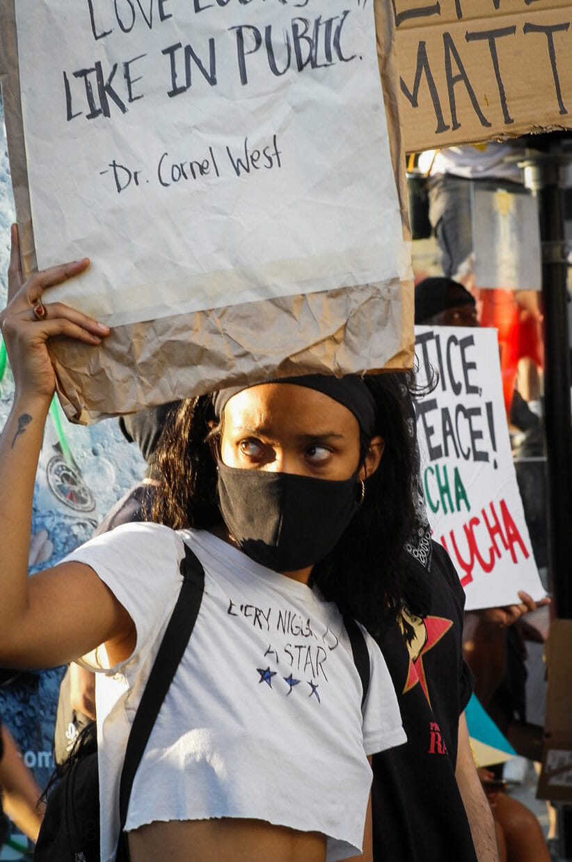 Woman with mask at City Hall.